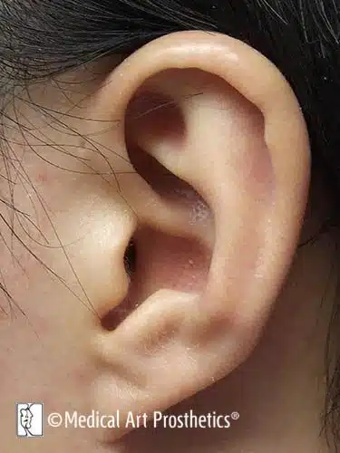 A close up of the ear of a person