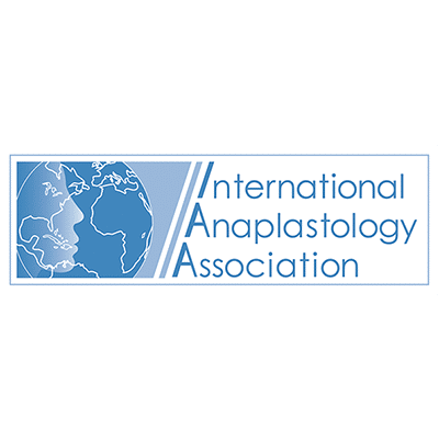 A blue and white logo for the international anaplastology association.