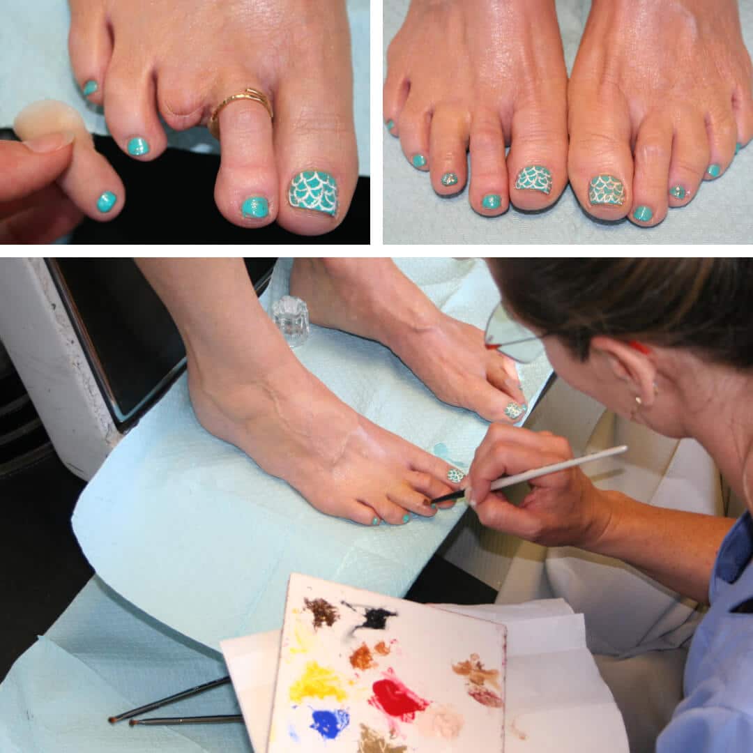 A woman painting her toenails with blue nail polish.