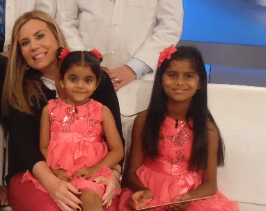 a woman and two girls posing for a picture