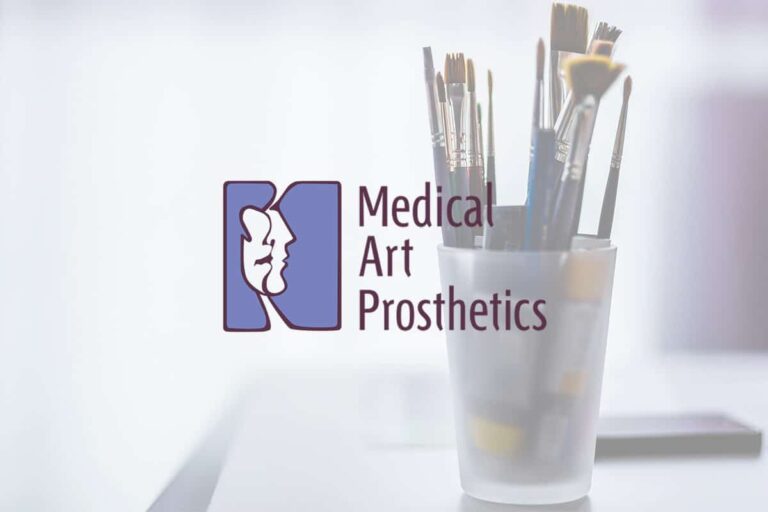 a cup with paint brushes in it