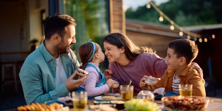 a family eating donuts at a table