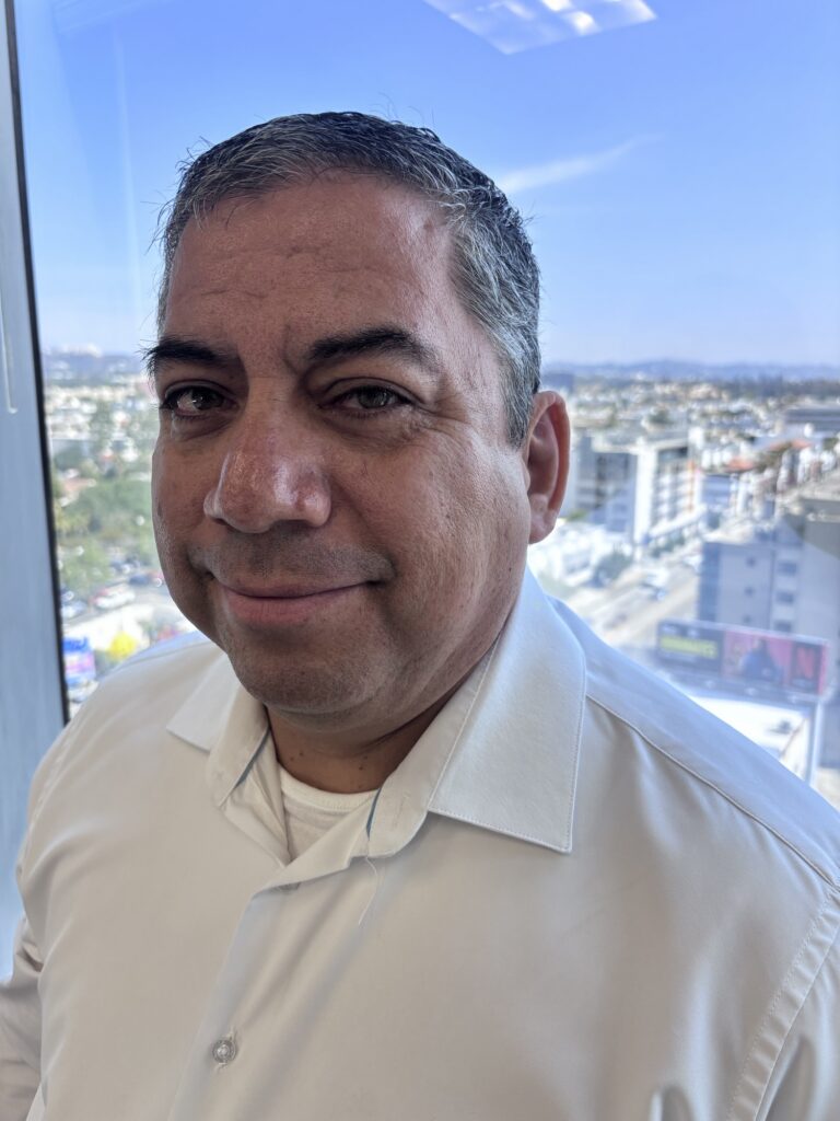 man smiling and happy with his ear prosthesis