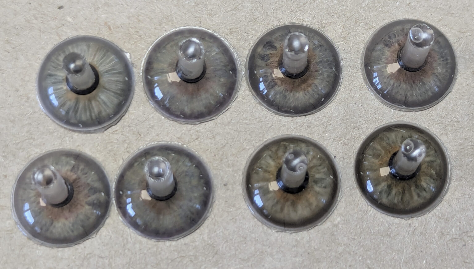 Picture of custom iris buttons for prosthetic eyes