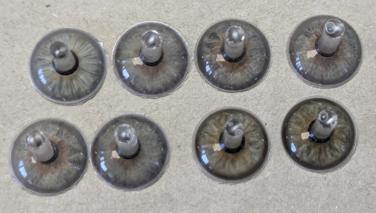 Picture of custom iris buttons for prosthetic eyes
